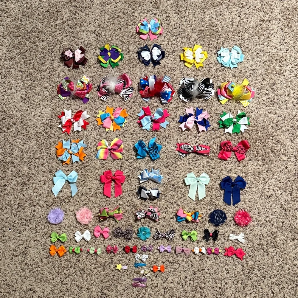 Girls bundle of bows and clips an assortment of sizes shapes and colors
